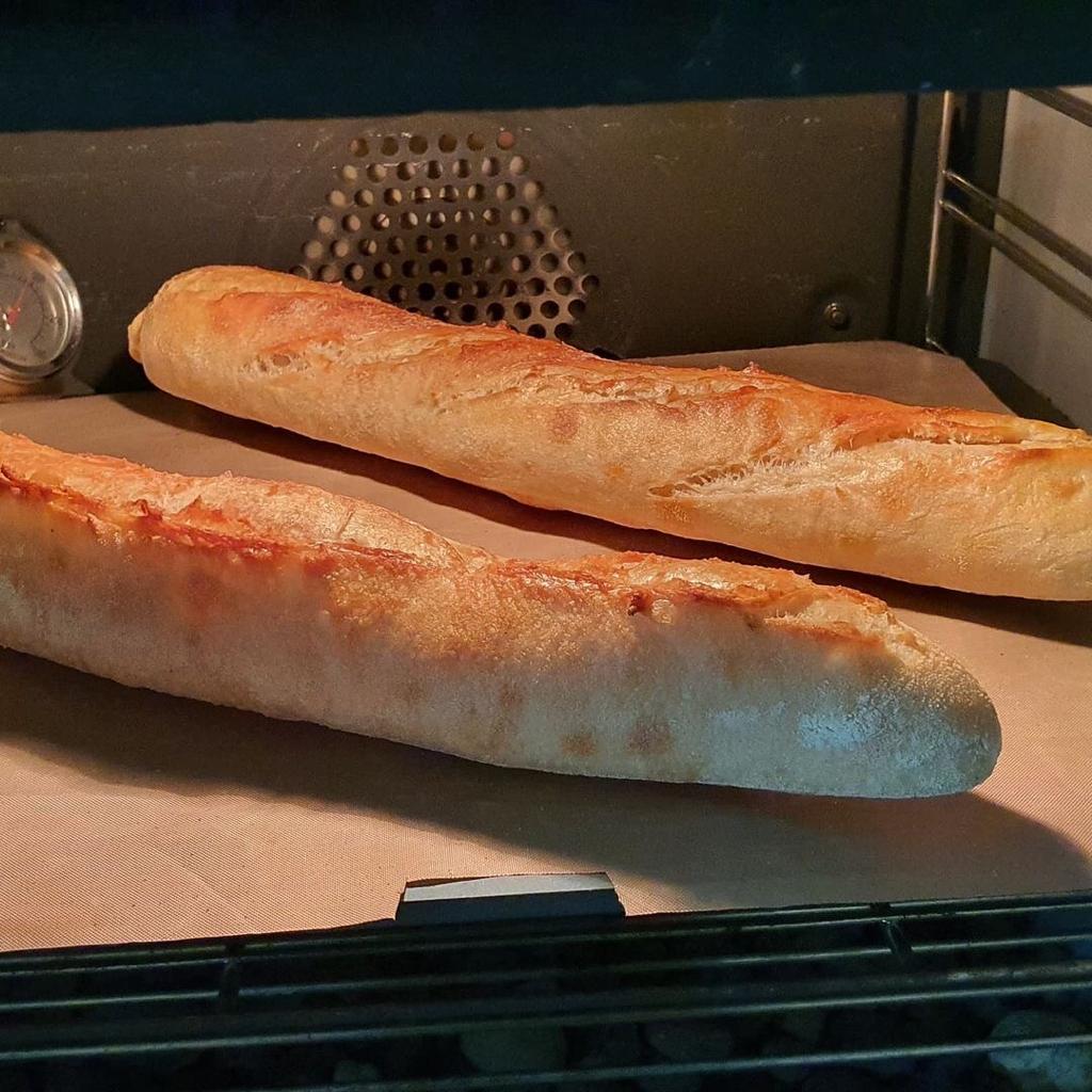 Two baguettes baking on a Steel Craft steel