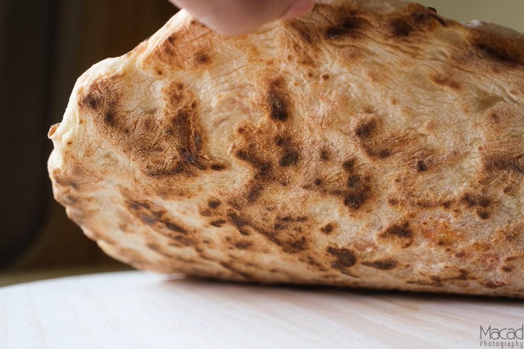 Charred naan bread fresh off a Steel Craft steel